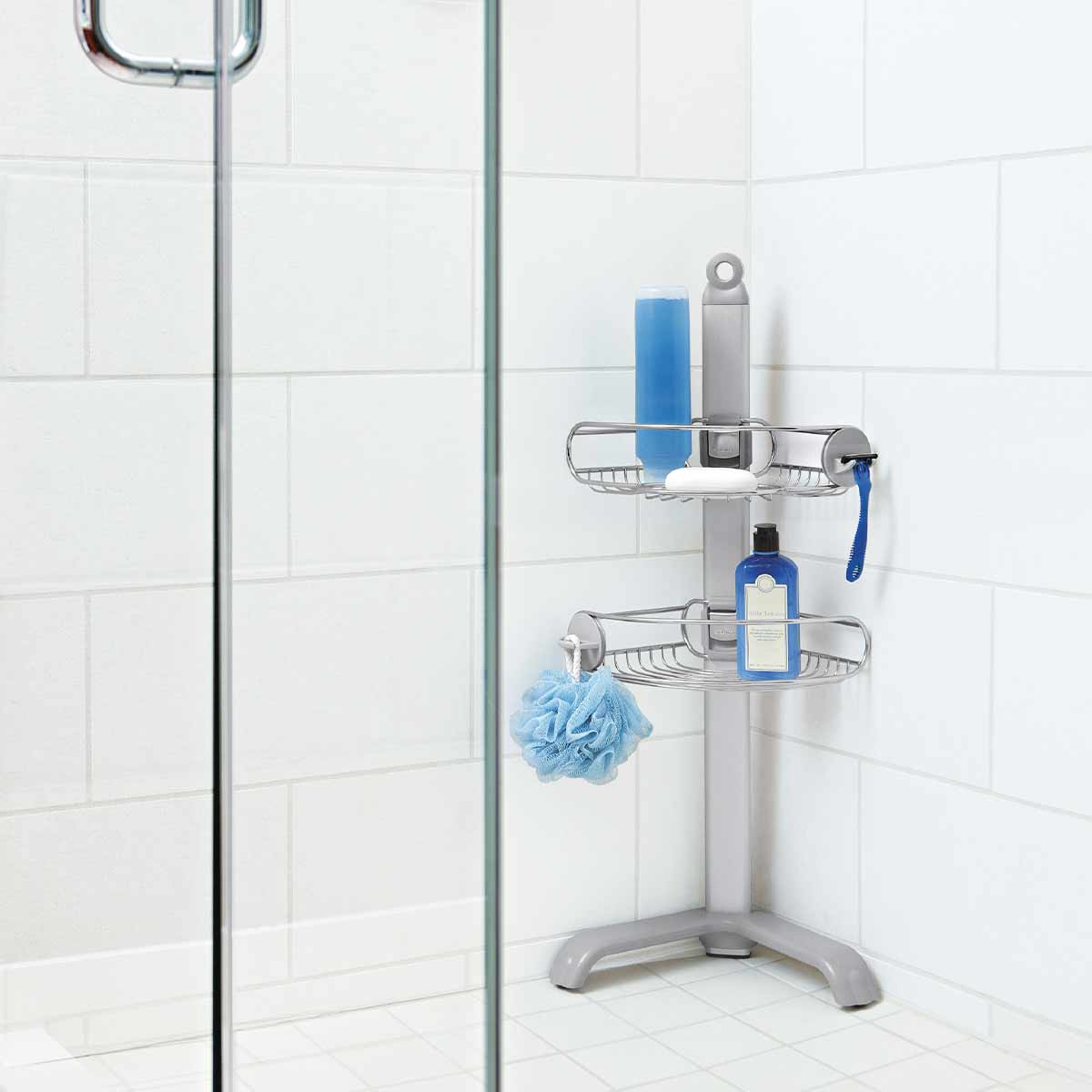 Simplehuman Corner Shower Caddy (Polished SS) used in corner, showing adjustable storage, integrated razor, and loofah hook.