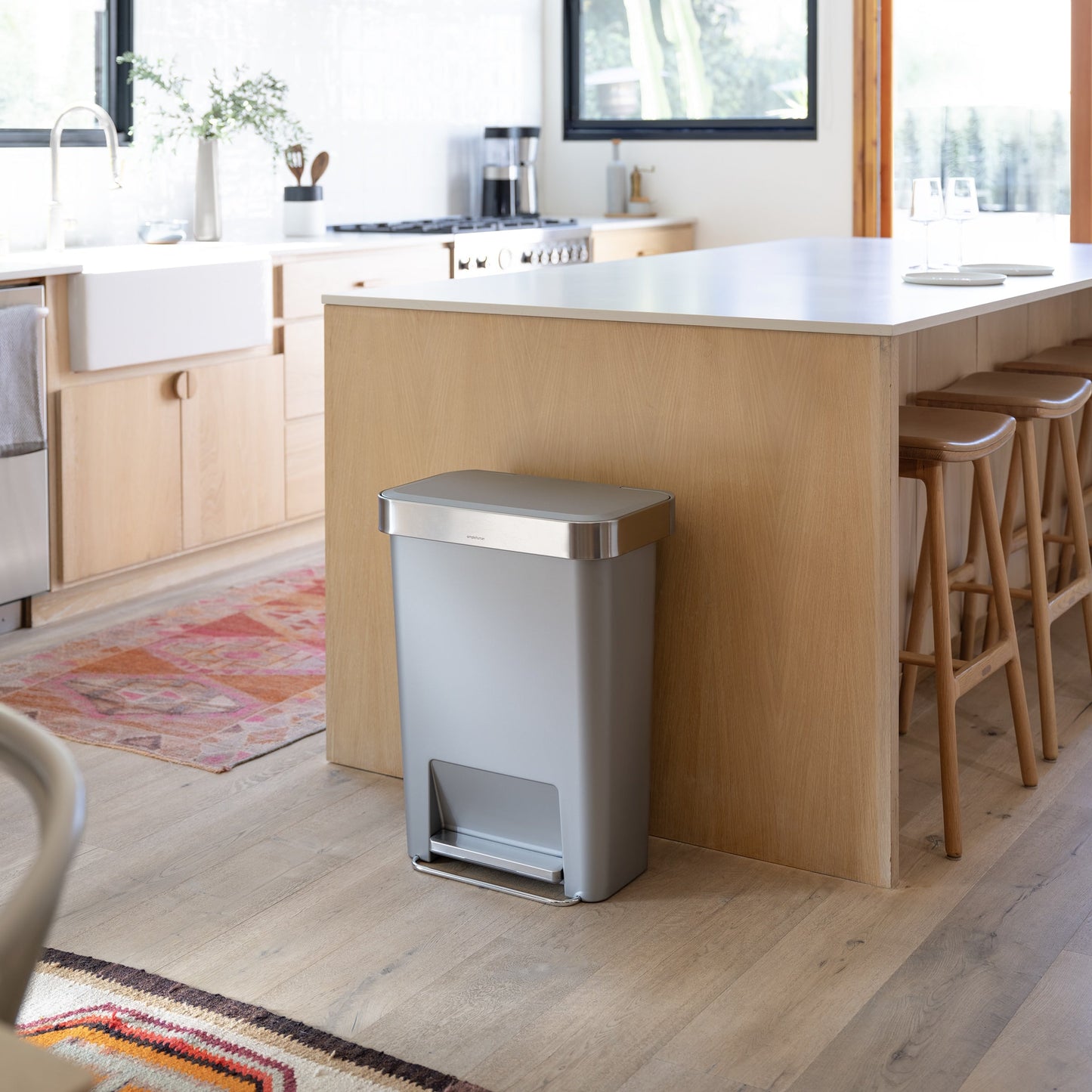 Simplehuman 45L Hybrid Step Can, Ultra Violet body, Brushed Steel lid, hands-free in a kitchen environment.