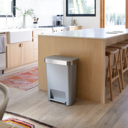 Simplehuman 45L Hybrid Step Can, Ultra Violet body, Brushed Steel lid, hands-free in a kitchen environment.