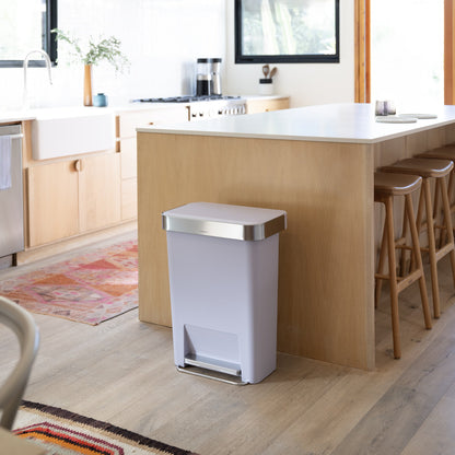 Simplehuman 45L Hybrid Step Can, Ultra Violet with Brushed Steel, hands-free in modern kitchen setting.