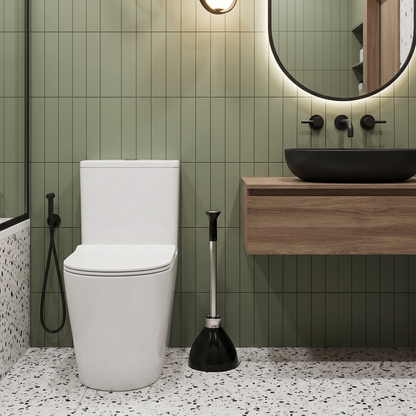 A Simplehuman Black Finished Toilet Plunger Placed Beside A Toilet.