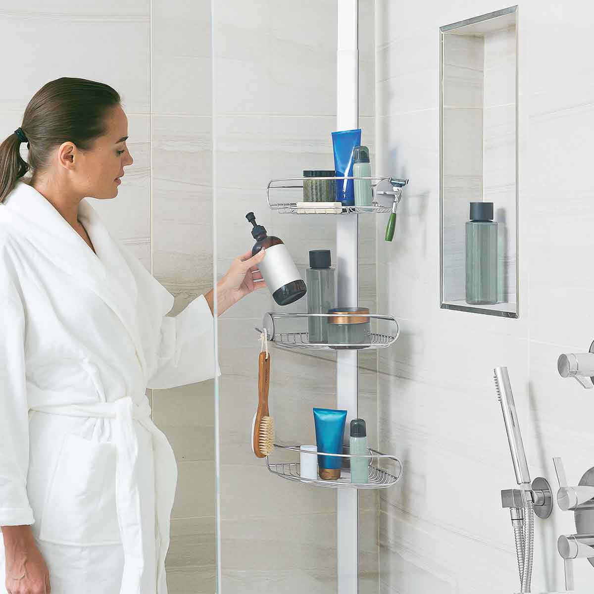 Simplehuman Polished Stainless Steel Tension Shower Caddy in use, adjustable shelves provide maximum storage organization.