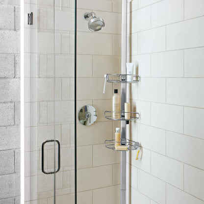 Angled view of Simplehuman Polished Stainless Steel Tension Shower Caddy, 3 adjustable shelves for shower organization.