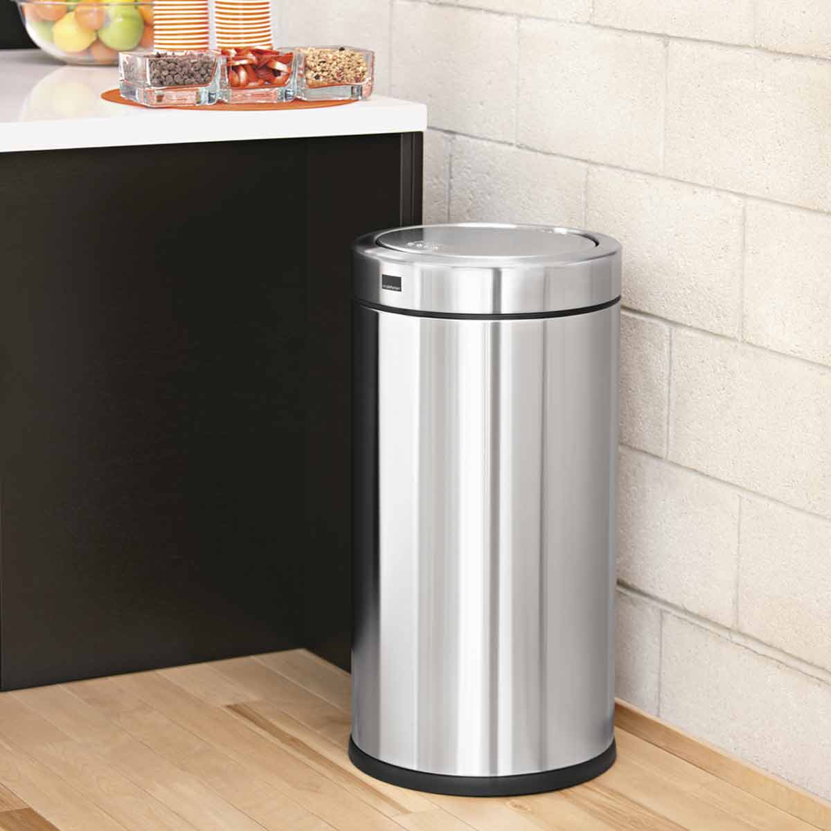 Angled view of Simplehuman 55L Swing Top Can in Brushed Stainless Steel, sleek kitchen waste solution.