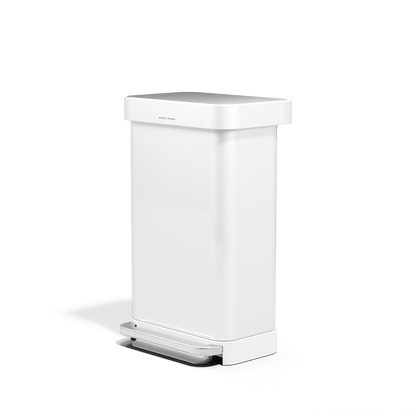 Angled view of Simplehuman 45L White Step Can with Brushed Stainless Steel pedal, liner pocket.
