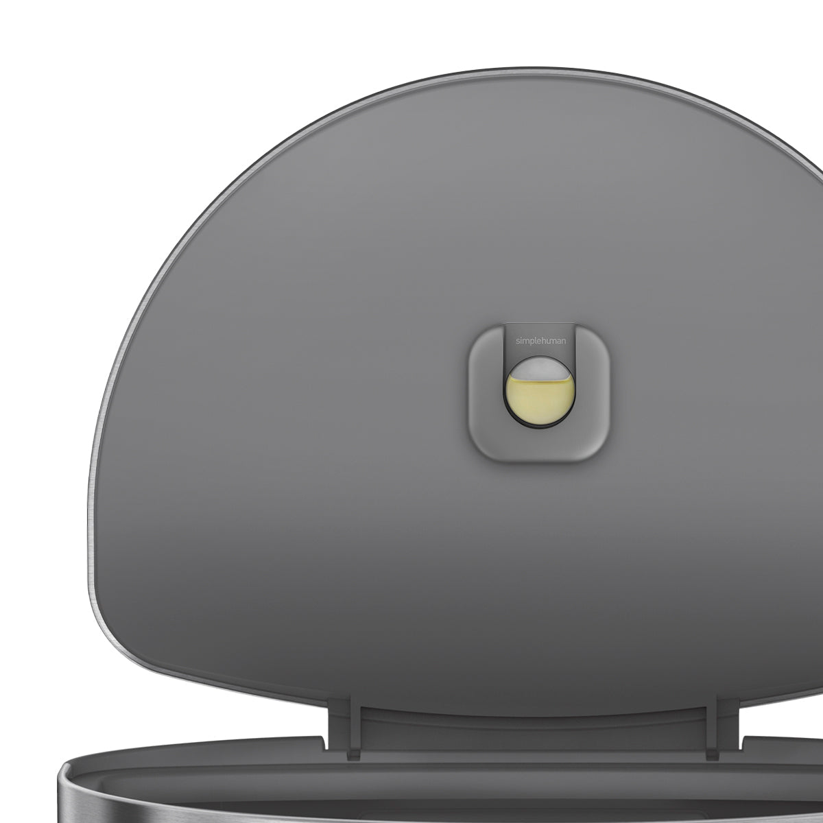 Detail view of Simplehuman 60L Semi-Round Step Can lid showing the built-in natural odor absorber pod.