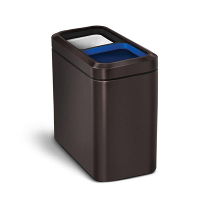 Angled view of Simplehuman Dark Bronze 20L Dual Slim Open Can showing blue recycling and white trash liners.