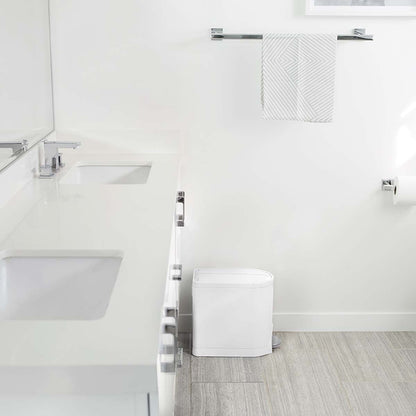 Simplehuman White 10L Butterfly Step Can in modern bathroom, narrow fit beside vanity, hands-free pedal.