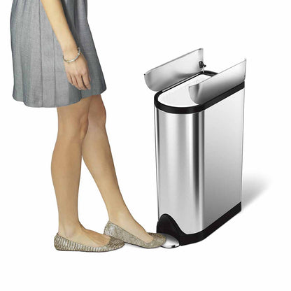 Simplehuman 18L Butterfly Step Can, Brushed Stainless Steel, showing hands-free pedal operation and unique butterfly lid opening.