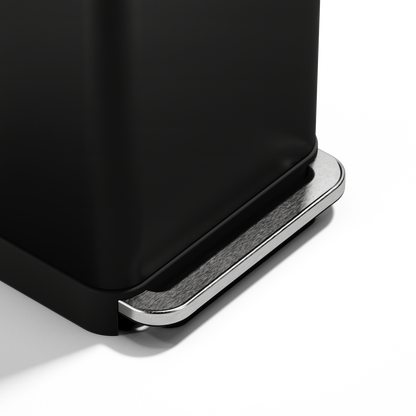 Detail view showing the robust Brushed Stainless Steel pedal of the Simplehuman Matte Black Step Can.