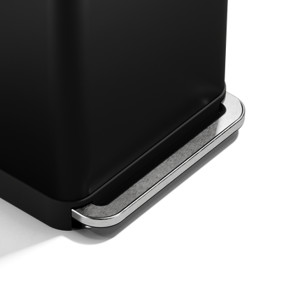 Close-up of Simplehuman 55L Rectangular Step Can pedal in Matte Black, showing hands-free stainless steel mechanism.