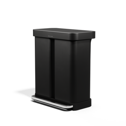 Angled view of Simplehuman 58L Step Recycler, Matte Black, dual compartment for recycling, hands-free pedal.