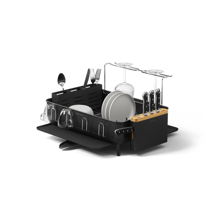 Studio view of Simplehuman Matte Black Dishrack, displaying modular wine glass rack, removable knife block, and utensil caddy.
