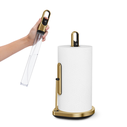 Simplehuman Brass Paper Towel Holder, action view showing removable spray handle for 2-in-1 cleaning.