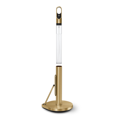 Detail view of Simplehuman Brass Paper Towel Holder, showing integrated spray bottle storage and quick-tear arm.