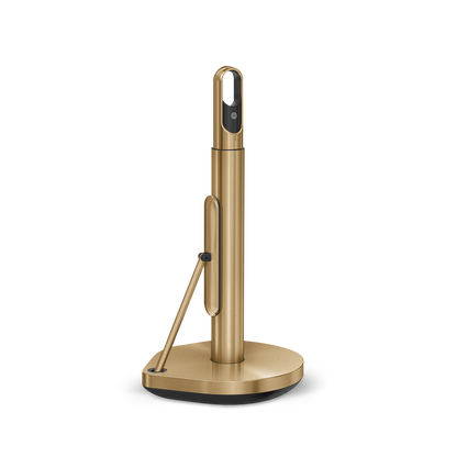 Angled view of Simplehuman Brass Paper Towel Holder, showing quick-tear arm and spray handle storage.