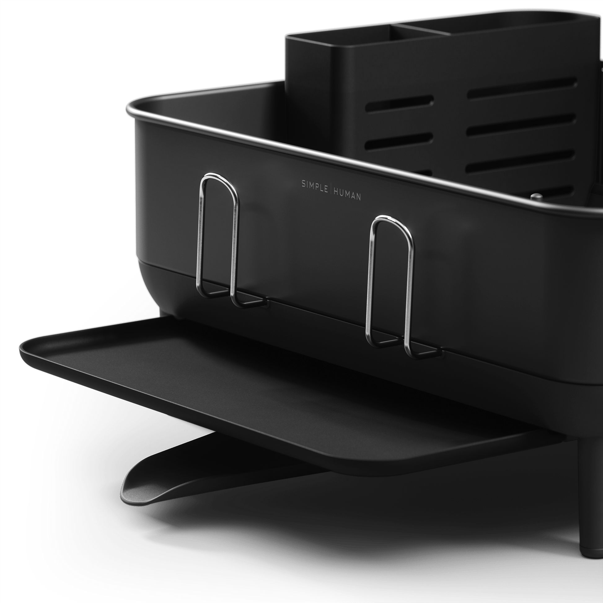 Close-up of Simplehuman Compact Steel Frame Dishrack, Matte Black, highlighting logo, polished steel handles, and extended spout.