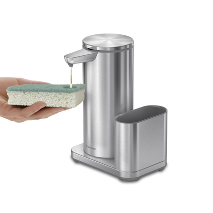 Simplehuman Brushed Stainless Steel Sensor Pump with Caddy dispensing soap onto sponge, touch-free.