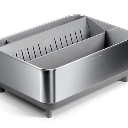 Close-up of Simplehuman Brushed stainless steel Bottle Dock with gray base and removable inner tray, detail view.