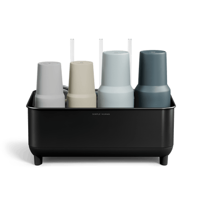 Front view of Simplehuman Matte Black stainless steel Bottle Dock holding four reusable bottles in assorted colors.