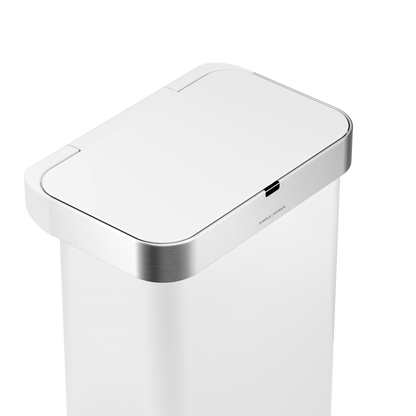 Detail view of Simplehuman 58L Sensor Can in White showing the touch-free sensor and Brushed Stainless Steel trim.