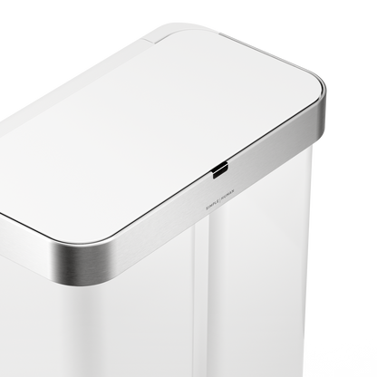 Detail view of Simplehuman 58L Sensor Recycler lid in White/Brushed Stainless Steel, highlighting the touch-free sensor.