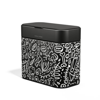 Angled view of Simplehuman Compost Caddy in Matte Black with white doodle pattern, odor-proof countertop use.