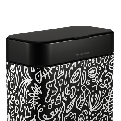 Close-up of Simplehuman Matte Black Compost Caddy with white doodle pattern, showing the tight, odor-proof seal and branding.