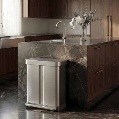 Simplehuman's 58L Step Recycler in Brushed in a modern kitchen setting white dark marble flooring and countertop featuring wooden cabinetry.