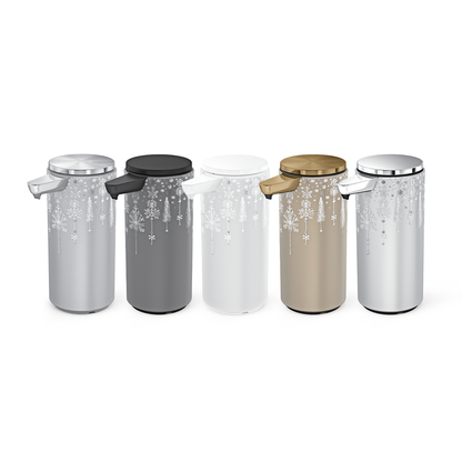 Simplehuman Angled view of all 9 oz. 2024 Holiday Sleeve color variations, featuring snowflake and tree design on touch-free dispensers.