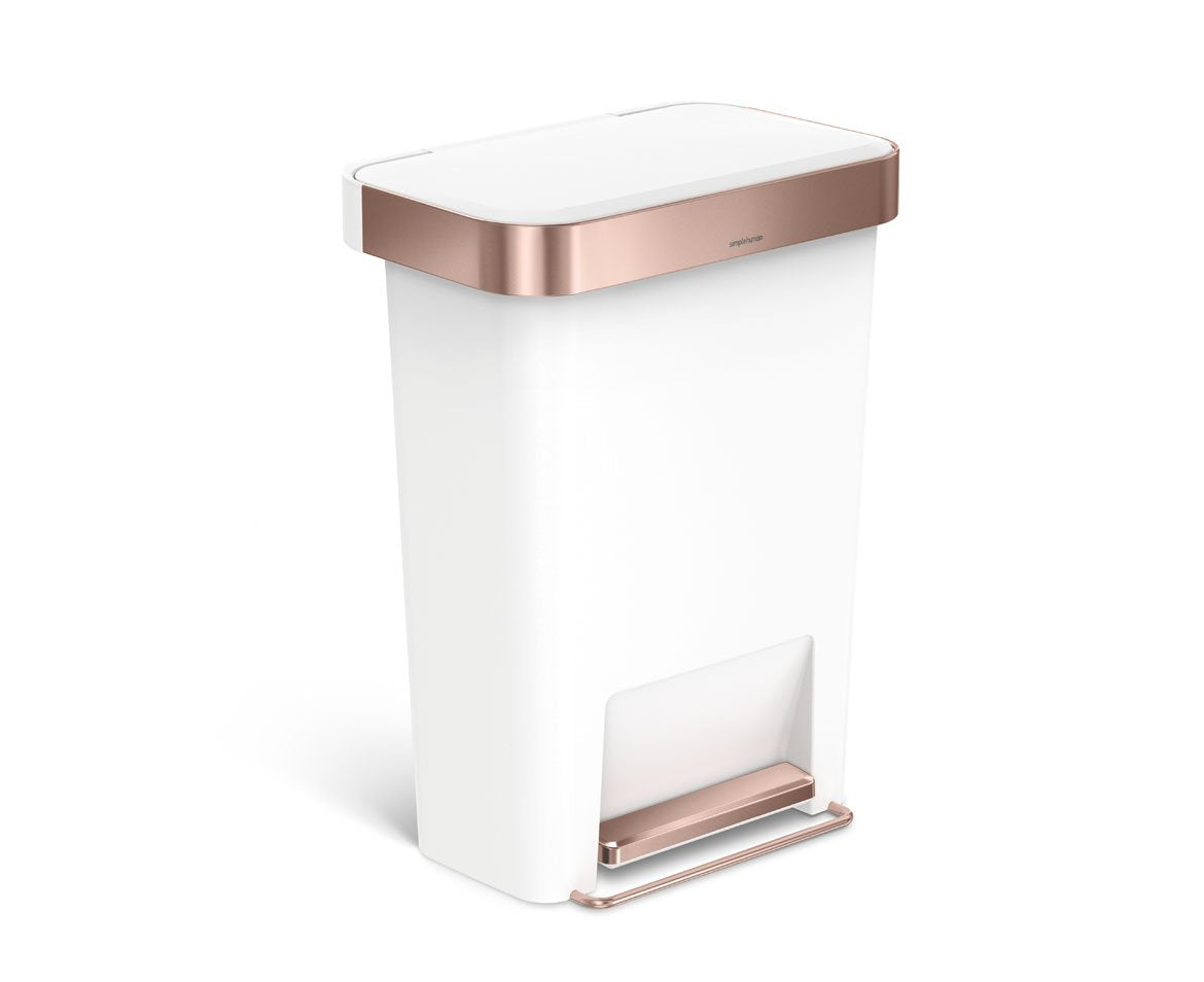 Angled view of Simplehuman 45L Hybrid Rectangular Step Can, White with Rose Gold trim, hands-free pedal.