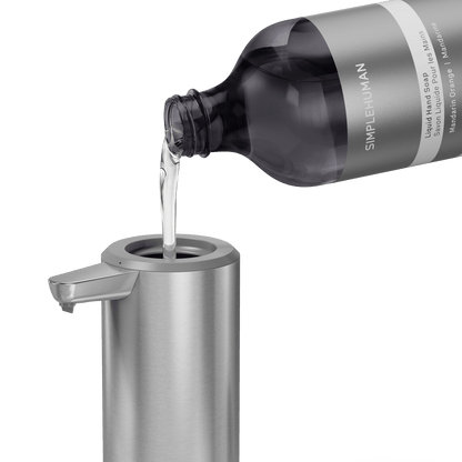 Simplehuman's Refill Bottle filling a Simplehuman Liquid Sensor Pump.